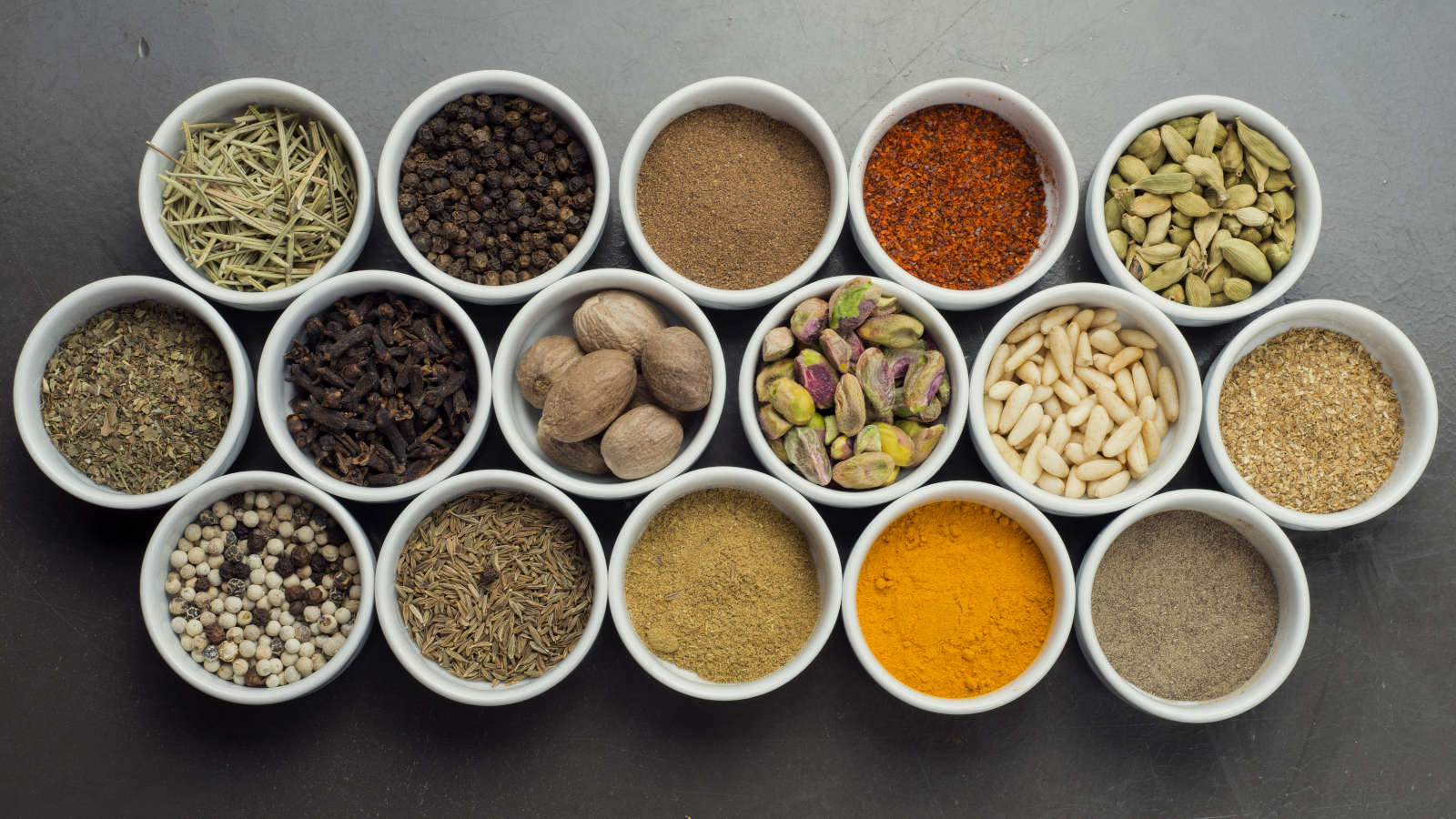 Spices and pulses in bowls, showing the range of soft commodities traded